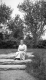 Woman Sitting on Stone Steps