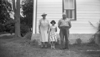 Family in Front of House