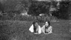 Two Girls Lying in a Field
