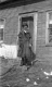 Girl in Front of Home