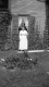 Woman in Front of Home