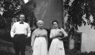 Individuals in Front of Home
