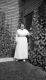 Woman Standing in Front of house