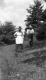 Couple Walking in Pasture