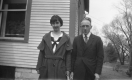 Couple in Front of Home