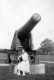 Women Sitting on Cannon
