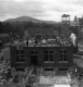 Brick laying the walls of the H.C. White Factory