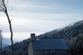 Stone House on Top of Snow Covered Mountain
