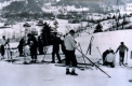 Group of Skiers on the Side of Snowy Hill
