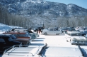 Snowy Parking Lot at the Base of A Mountain
