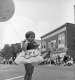 Girl Holds Balloon at Parade