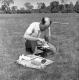 Worker Inspects Soil Sample