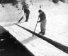 Two Men Cutting Ice