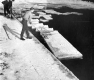 A man cutting ice