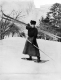 Women Snowshoeing while Carrying Skis   