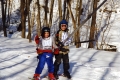 Two Kids Skiing