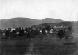 Grassy foreground and hill in the background