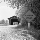 Covered Bridge and Road Sign