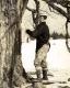 Severy man collecting sap from sugar maple