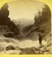 Two Men looking at water flowing through Bolton Gorge