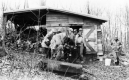 Wooden shed and wood pile