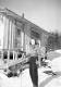Woman in Front of Ski Shack