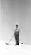 Shirtless Man On Snowy Mountain