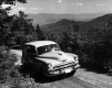 Station Wagon Driving Up a dirt road
