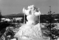 Winter Carnival Snow Sculpture - Dog Holding Ski Poles
