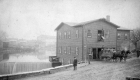 HT Cushman Standing by Building