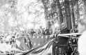 Group of Men on a Platform Draped with an American Flag