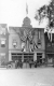 Several Men in Front of Building