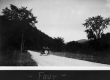 Back of a car on a dirt road
