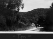 Car driving along a dirt road