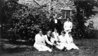 Family in Front of Home