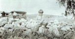 Young Boy on a Stone Wall
