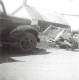 Two Men Working on a Car