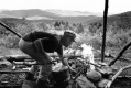 Building a fire on a hillside