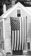 Wooden Home with American Flag