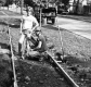 Two Men Working