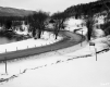 Highway and River through Snow Covered Landscape