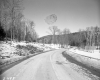 Highway through Snow Covered Landscape