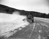Snow Plow Clears Road
