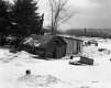 Sugarhouse in Field with Farm Equipment