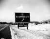 Exit Sign Brattleboro with Houses and Mountains