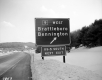 Exit Sign Brattleboro and Bennington Descending Hill Close-up