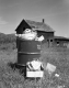 Trash Can and Abandoned House on Route 12