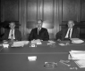 Three Men at Conference Table