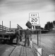 Burlington Interstate 89 Four Men Two Secure Sign