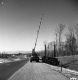 Crane Hoisting Route 7 Sign on Interstate 189